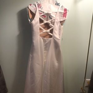 Long elegant wedding gown (long white gown) with cross back detail.